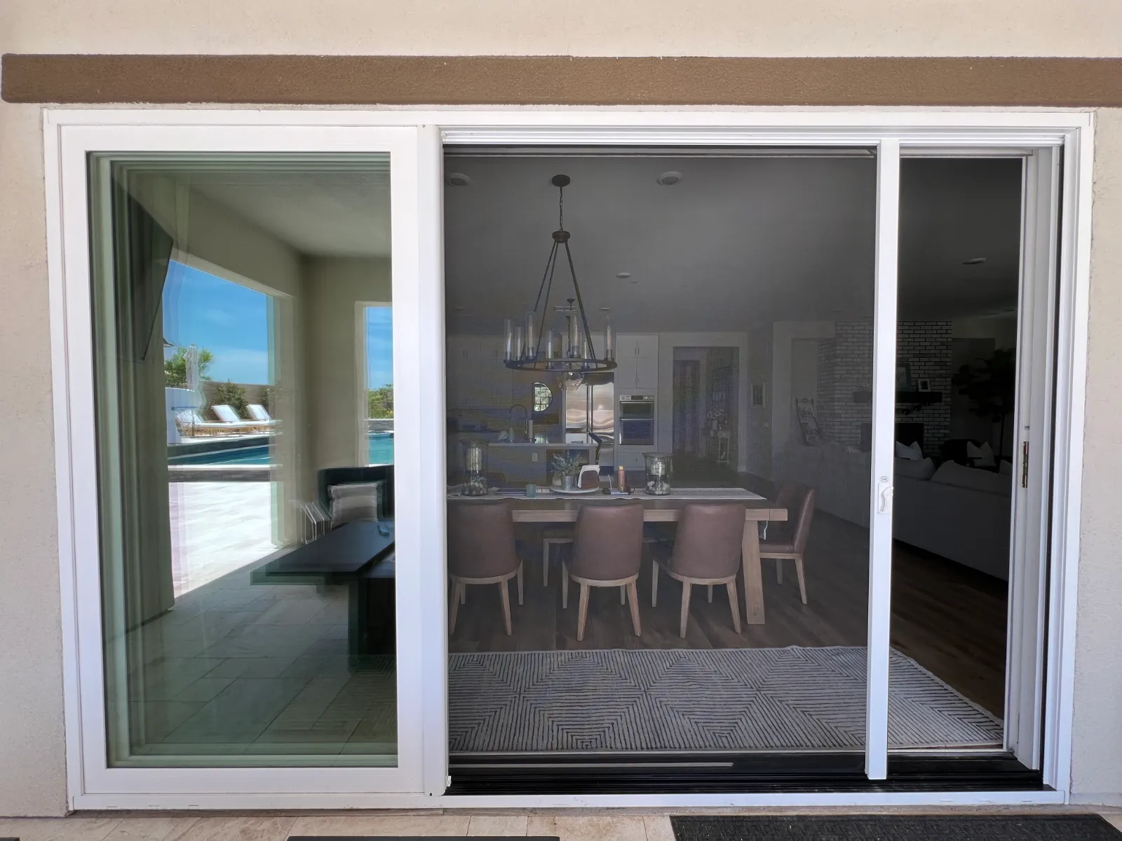 Screen door installed on a sliding glass door in a Santa Clarita home